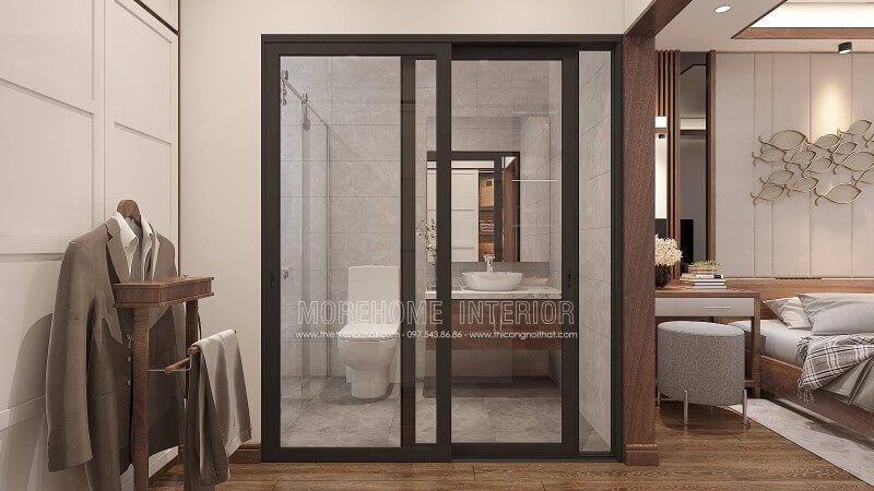 Bạn đang băn khoăn với ý tưởng trang trí phòng ngủ nam khép kín khi sử dụng gỗ óc chó làm vật liệu chủ đạo phòng ngủ thì phòng tắm nên trang trí như nào cho hợp lý mà vẫn giữ nguyên vẻ đẹp sang trọng đó. Ý tưởng bố trí phòng tắm cửa kính trượt viền đen kết hợp không gian màu xám từ gạch ốp giả bê tông cùng tủ đựng đồ phòng tắm bề mặt đá vân mây với lớp cánh gỗ óc chó sẽ là gợi ý khá độc đáo trong căn hộ chung cư, nhà phố, nhà liền kề, biệt thự.